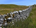 Brightly lit dry stone wall at Malham Cove, Yorkshire Royalty Free Stock Photo