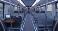 Brightly Lit Modern Train Interior with Empty Rows of Comfortable Passenger Seats Royalty Free Stock Photo