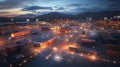 Brightly lit shipping container yard showcasing IoT technology at dusk in a modern logistics facility Royalty Free Stock Photo