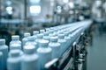 Bottles moving along an automated conveyor belt in a modern manufacturing facility preparing for packaging in a clean industrial Royalty Free Stock Photo