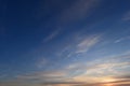 Brightly lit in sunset  blue sky in white cirrus clouds Royalty Free Stock Photo