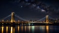 A brightly lit suspension bridge glowing against a night sky Royalty Free Stock Photo