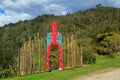 A brightly painted arch with Maori carvings, New Zealand