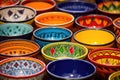 brightly painted ceramic bowls in an array