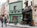 Brightly painted, flower-bedecked cafe Odette in the Latin Quart Royalty Free Stock Photo