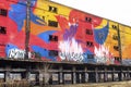 St Louis, Missouri, USA, December 2019 - graffiti spray painted with loud colors on long abandoned concrete building in city