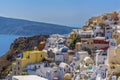 Brightly painted houses and blue-domed churches in the village of Oia, Santorini Royalty Free Stock Photo