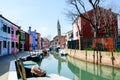 Brightly painted houses, tilted tower in Burano