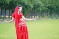 Brightness of dance Asian Chinese belly dancer in red dress