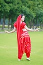 Brightness of dance Asian Chinese belly dancer in red dress