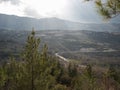 Brightness landscape. Road, mountains and trees Royalty Free Stock Photo