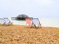 Brighton Beach and characteristic striped beach chairs Royalty Free Stock Photo