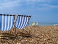 Brighton Beach and characteristic striped beach chairs Royalty Free Stock Photo