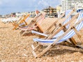 Brighton Beach and characteristic striped beach chairs Royalty Free Stock Photo