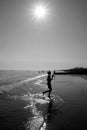 Boy on the waters edge of Brighton beach