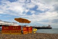 Brighton: beach life guard and pier Royalty Free Stock Photo
