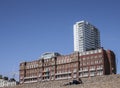 Brighton beach - pebbles and buildings on a sunny day.