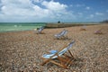 Brighton beach striped deckchairs sussex england