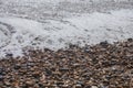 Brighton beach - waves and pebbles on a sunny day.