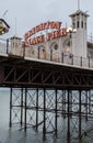 Photograph of Palace Pier, showing the illuminated sign. Brighton, East Sussex UK