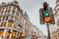 Brighton, England-18 October,2018: Traffic light and people in Piccadilly Circus in London. Famous place for shopping and travel