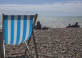 Brighton, England, the UK - a beach and a beach chair. Royalty Free Stock Photo