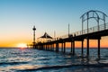 Brighton jetty with people walking along at sunset Royalty Free Stock Photo