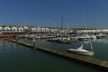 Brighton Marina, view of the harbour, with a sailing boat. Brighton, UK