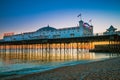 Brighton Pier beach with sunset golden hour at Sussex England, UK. Brighton Marine Palace and Pier popular place for visitor Royalty Free Stock Photo