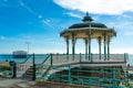 Brighton Pier Beach with Victorian bandstand octagonal pavilion Chinese and Indian style in the background Royalty Free Stock Photo