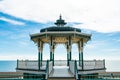 Brighton Pier Beach with Victorian bandstand octagonal pavilion Chinese and Indian style in the background Royalty Free Stock Photo