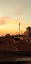 Brighton pier sunset beach pebbles  water sea Royalty Free Stock Photo