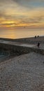 Brighton pier sunset busy Christmas beach pebbles Royalty Free Stock Photo