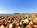 Brighton pier taken on the seashore and its pebble beach.