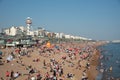 Crowd of British people sunbathing swimming and relaxing in the beach at summer. Leisure time outdoor