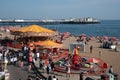 Crowd of british people walking and having fun at brighton town coastline. People active outdoor