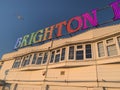 Brighton word in rainbow colours lights east sussex peir blue sky and seagull