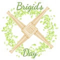 Brigid`s Day. Beginning of spring pagan holiday. Brigid`s Cross in a wreath of green leaves