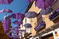 BRIHUEGA, SPAIN - JULY 10, 2021: Violet umbrellas and decor at the street during lavender fields blooming period, Brihuega,