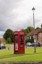 Brill, United Kingdom - 26 07 2020: Red british phonebox in the middle of small village Brill in UK, symbolic object for United
