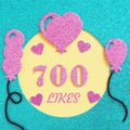 a brilliant banner for posting on a social network about 700 likes with balloons and hearts