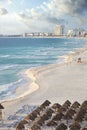 Brilliant blue sea and curving beach in Cancun, Mexico