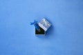 Brilliant blue usb flash memory card with a blue bow lies in a small gift box in blue with a small bow on a blanket of soft and fu Royalty Free Stock Photo