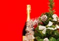 Brilliant Christmas and New Year`s decor.Decorative fir-tree with silver decoration and Bottle of champagne decorated Royalty Free Stock Photo