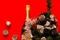 Brilliant Christmas and New Year`s decor.Decorative fir-tree with silver decoration and Bottle of champagne Royalty Free Stock Photo