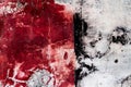 Brilliant colorful cracked plaster background in red white and black tones