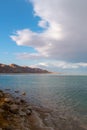 The brilliant colors of the Dead Sea and the clouds on a Winter`s day. Royalty Free Stock Photo