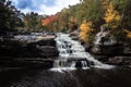 Brilliant fall foliage surrounds the beautiful cascading Shohola Falls in the Pennsylvania Poconos