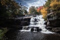 Brilliant fall foliage surrounds the beautiful cascading Shohola Falls in the Pennsylvania Poconos