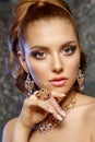 Brilliant. Girl with luxury jewelry. Model with a precious stone. Woman with a diamond